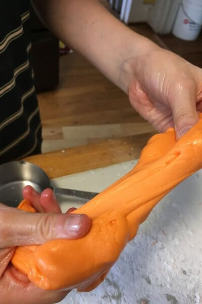 stretching candy corn slime 