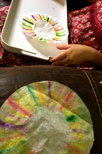 drawing on coffee filters to make the wings of a butterfly