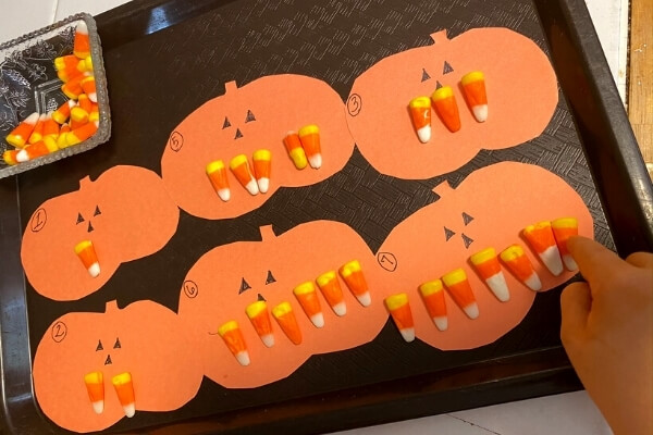 Candy corn counters on pumpkins