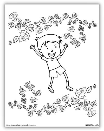 boy jumping in leaves above and below