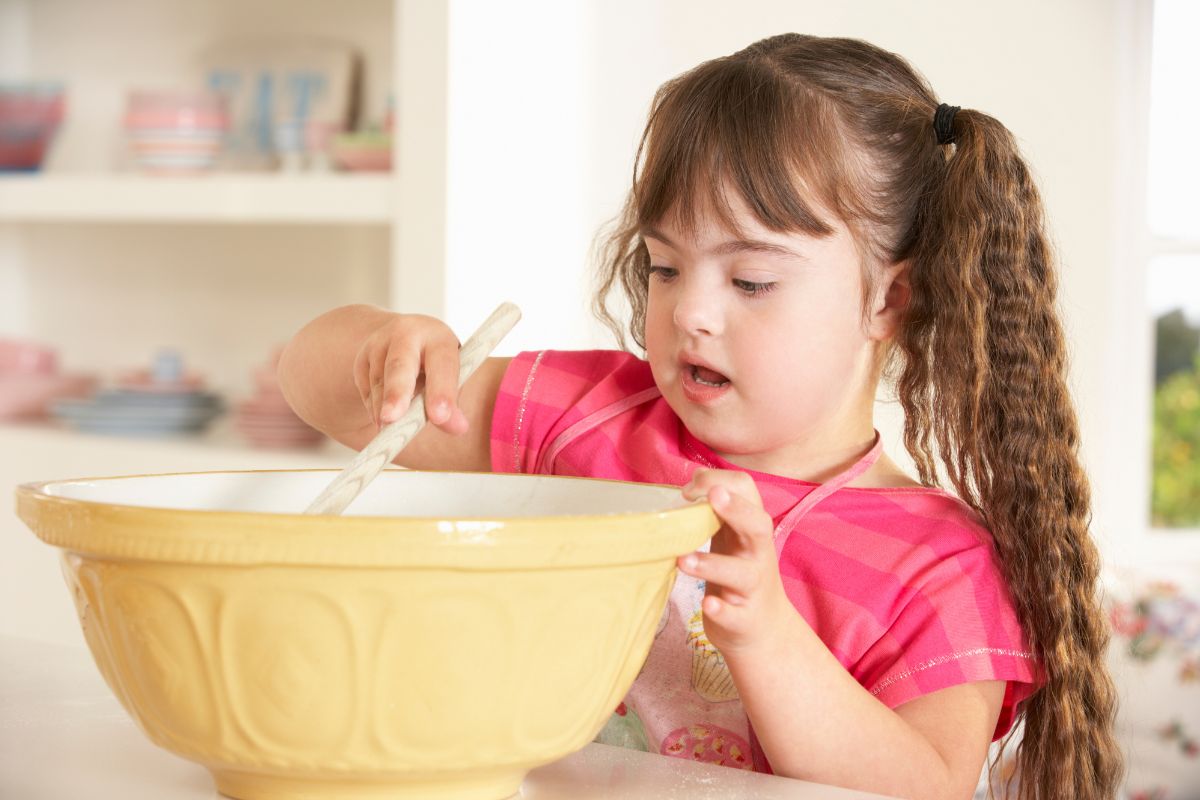 child baking in a large bowl