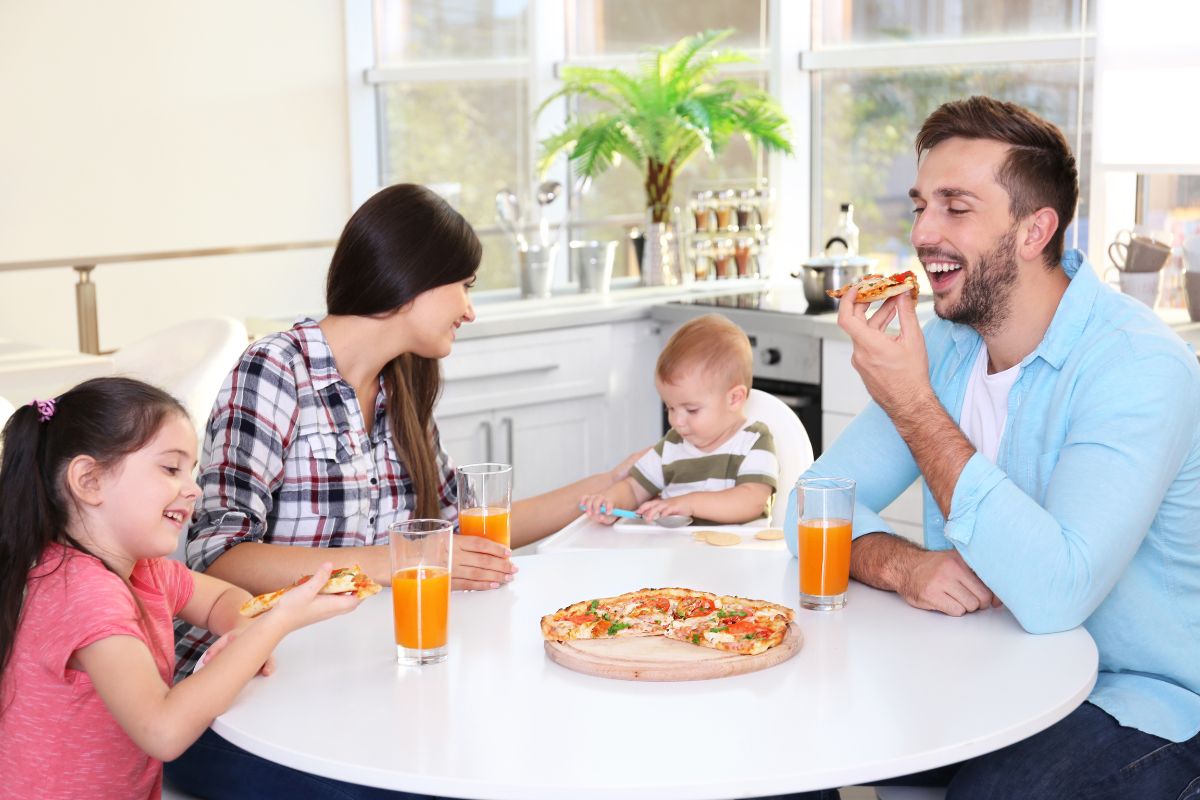 family eating together with kids and baby