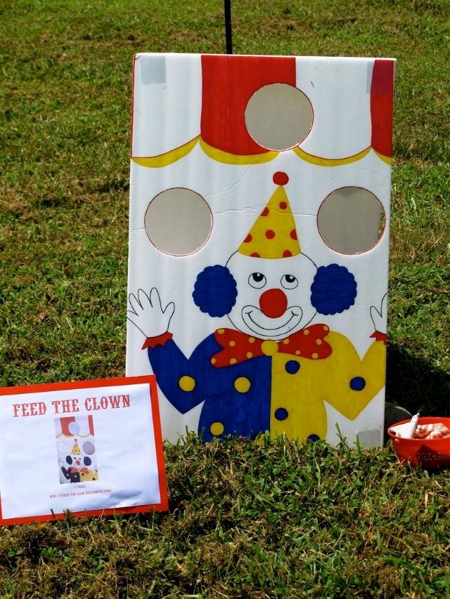 clown drawn on a large board for tossing bean bags through the holes