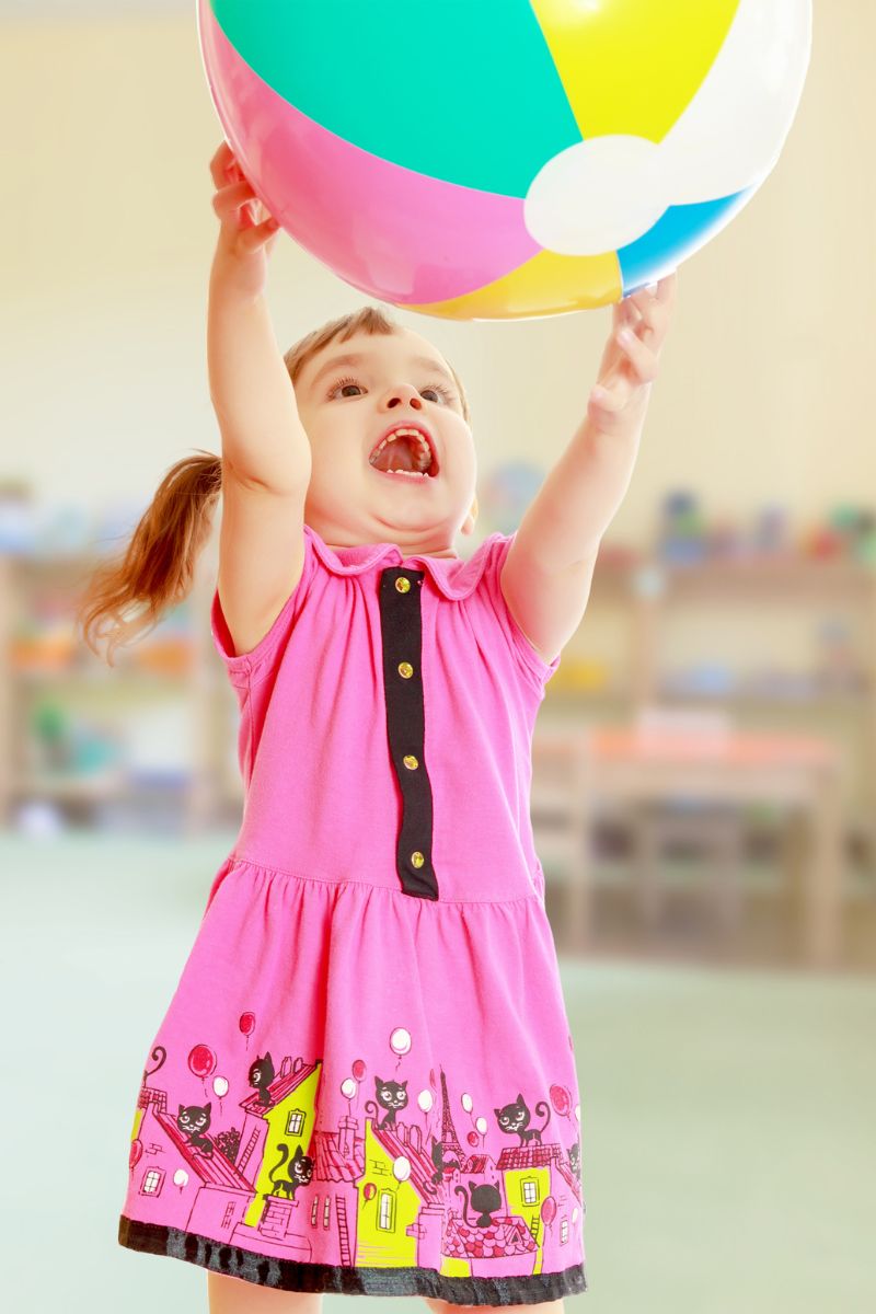 toddler with beach ball